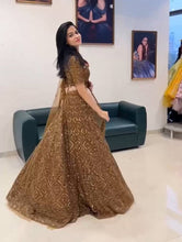 Load image into Gallery viewer, Rust Color Sequence Work Soft Net Lehenga Choli
