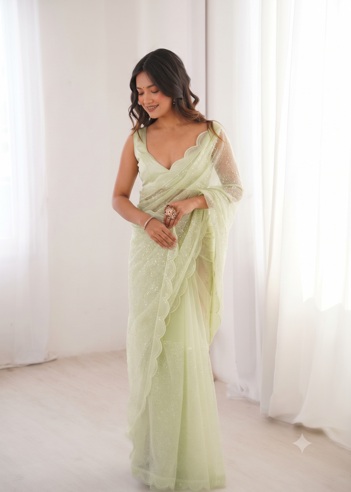 Embellished Net Saree with Intricate Tone-on-Tone Sequin Work and Scalloped Hemline with Unstitched Blouse