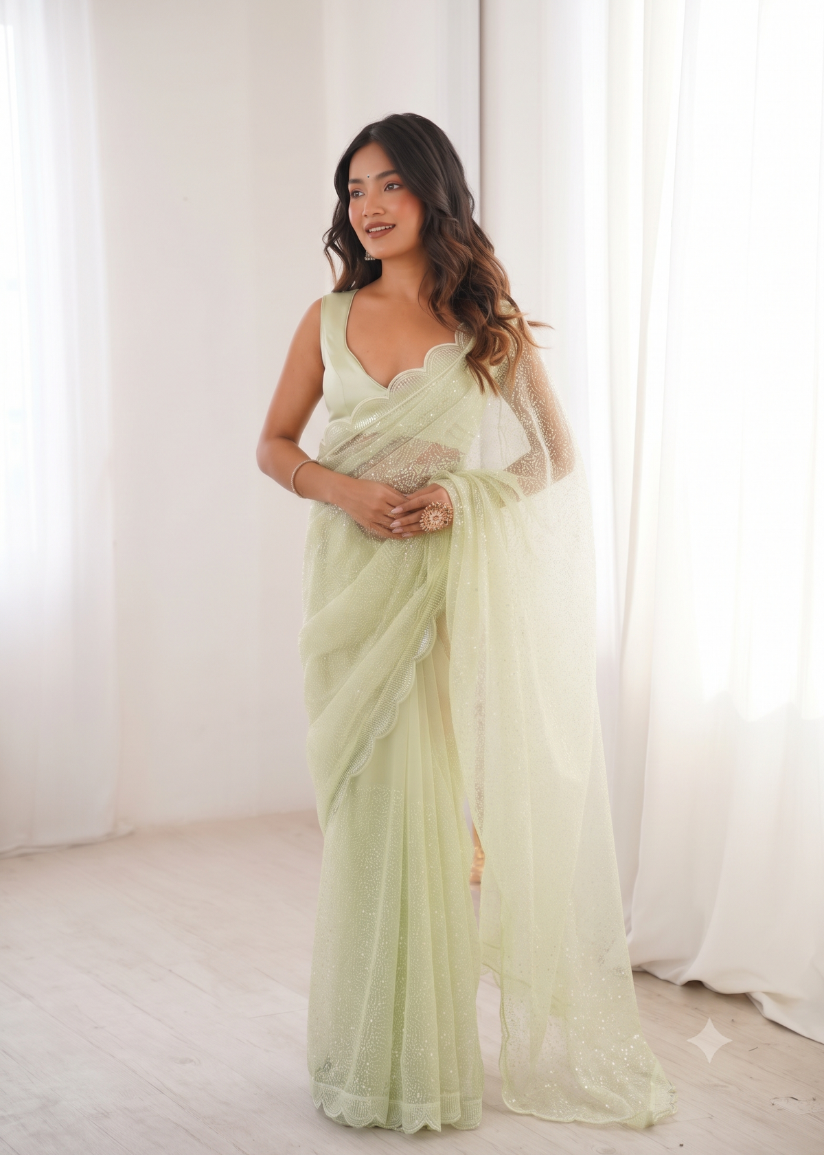 Embellished Net Saree with Intricate Tone-on-Tone Sequin Work and Scalloped Hemline with Unstitched Blouse