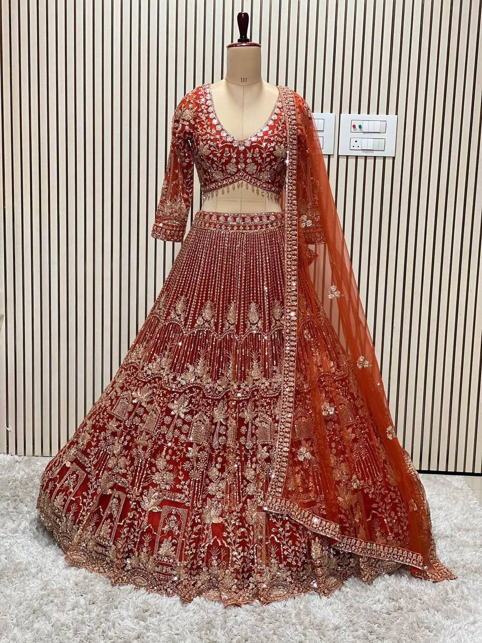 Orange Heavy Embroidered Lehenga Choli
