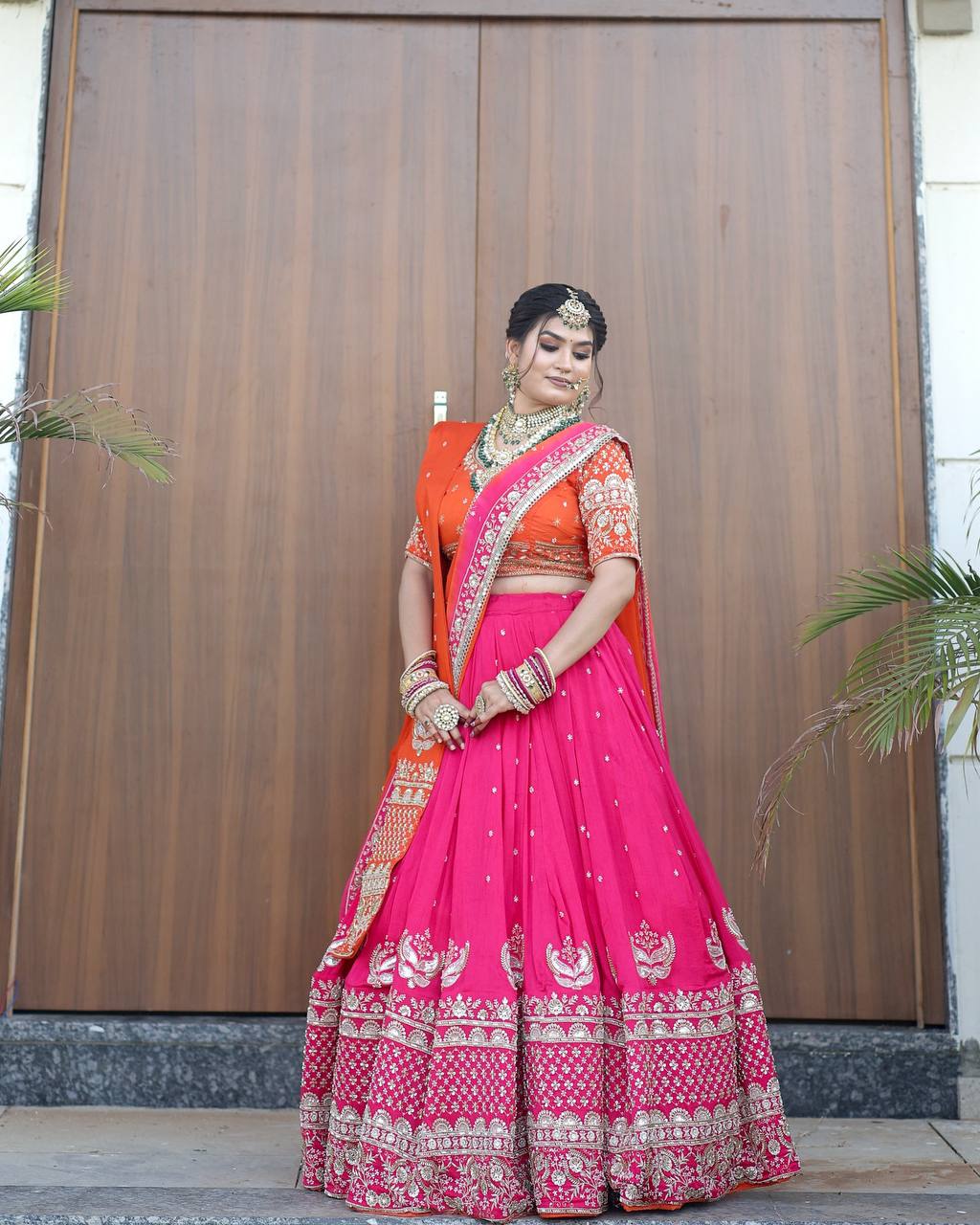 Graceful Pink And Orange Bridal Lehenga with Double Dupattas