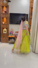 Load and play video in Gallery viewer, Unique Lemon Yellow Soft Net Semi Stitched Designer Lehenga Choli For Girls
