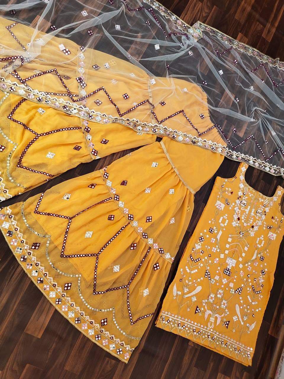 Astonishing Mustard Color Party Wear Mirror Embroidered Work Georgette Sharara Suit