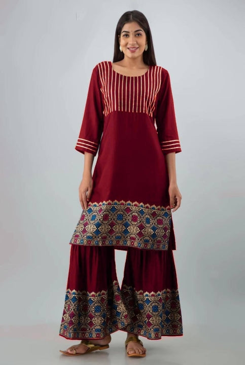 Desirable Maroon Color Full Stitched Golden Printed Rayon Kurti Plazo