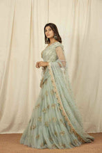 Load image into Gallery viewer, Blooming Green Color Net Function Wear Sequence Work Lehenga Choli
