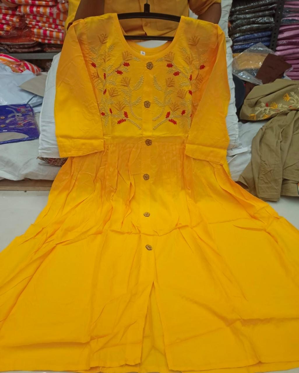 Refreshing Yellow Color Full Stitched Rayon Embroidered Work Kurti